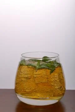Refreshing drink with gas bubbles. Nalit in a transparent glass. It laid crus Stock Photos