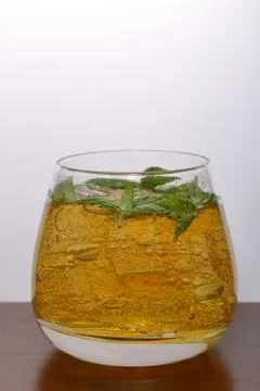 Refreshing drink with gas bubbles. Nalit in a transparent glass. It laid crus Stock Photos