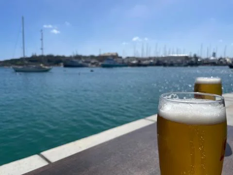 Refreshing Drink by the Harbor Stock Photos