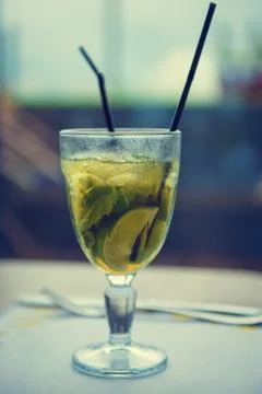 Refreshing drink with lemon and mint in the restaurant. Mojito Stock Photos