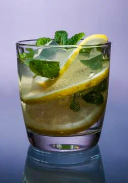 Refreshing drink with lemon, mint and ice Stock Photos
