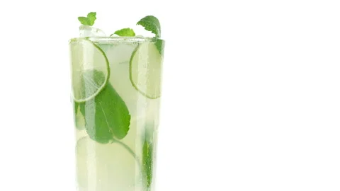 Refreshing drink lemonade with lime, mint and ice on white background Stock-Footage 147925273
