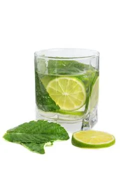 Refreshing drink with lime and mint on a white background Stock Photos