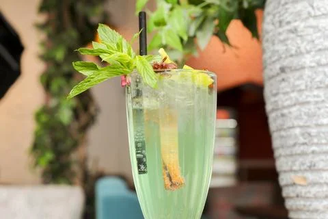 Refreshing drink with mint and lime at a outdoor cafe setting Stock Photos