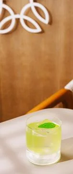 Refreshing drink on a table in a modern setting with wood background Stock Photos