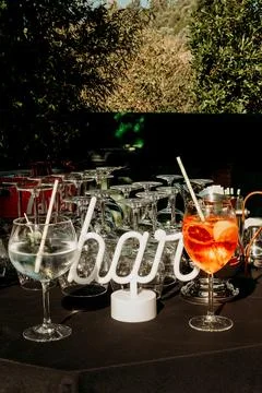 Refreshing drinks at bar during  social gathering in an outdoor setting in af Stock Photos