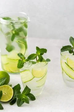 Refreshing drinks with lime and cucumber Stock Photos