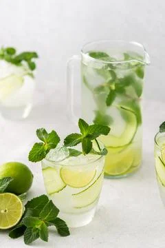 Refreshing drinks with lime and cucumber Stock Photos