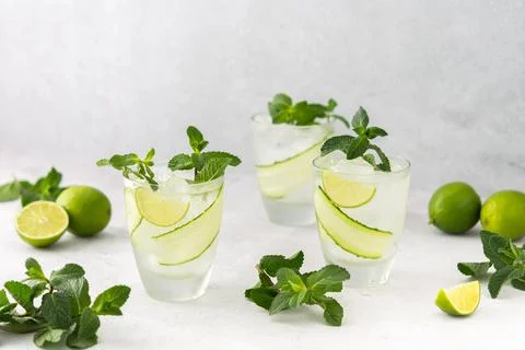 Refreshing drinks with lime and cucumber Stock Photos