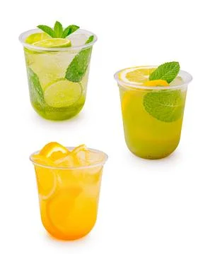 Refreshing drinks with lime, lemon, and orange served in clear cups at a part Stock Photos