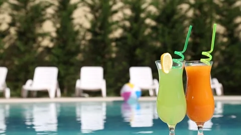 Refreshing Drinks by Resort Swimming Pool 動画素材 339702589