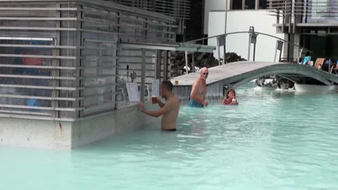 Refreshing Drinks at the Swim-Up Bar in the Blue Lagoon, Iceland Video stock 321063045