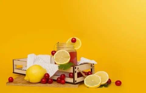 Refreshing freshly squeezed juice in a drinking jar on a wooden stand Stock Photos