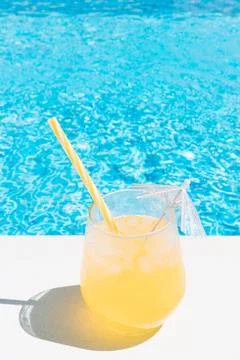 A refreshing fruit juice by the pool. summer concept, holidays and food Stock Photos