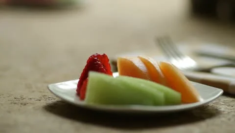 Refreshing fruit plate at a high end resort on a sunny summer morning 스톡 동영상 10915037