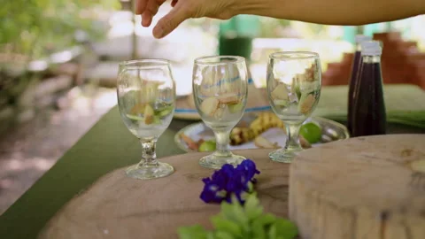 Refreshing ginger and lemongrass drink preparation masterclass in a serene Stock Footage 301540740