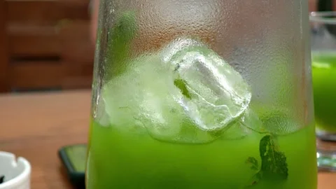Refreshing Green Drink with Ice and Mint in a Pitcher Stock-Footage 315361105