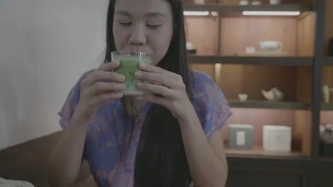 Refreshing Green Drink Tasting Experience Stock Footage 322855687