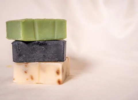 Refreshing handmade soaps made of roses, aloe vera and activated carbon stack Stock Photos