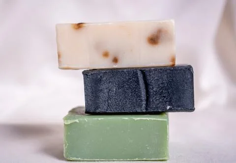 Refreshing handmade soaps made of roses, aloe vera and activated carbon stack Stock Photos