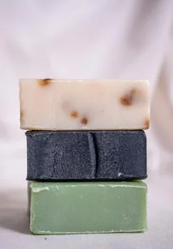 Refreshing handmade soaps made of roses, aloe vera and activated carbon stack Stock Photos