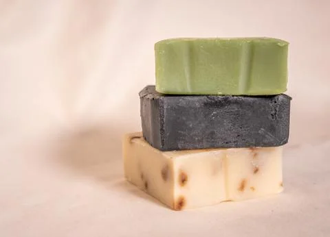 Refreshing handmade soaps made of roses, aloe vera and activated carbon stack Stock-Fotos