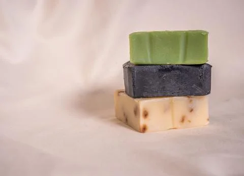 Refreshing handmade soaps made of roses, aloe vera and activated carbon stack Stock Photos