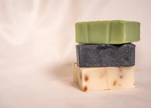 Refreshing handmade soaps made of roses, aloe vera and activated carbon stack Stock Photos