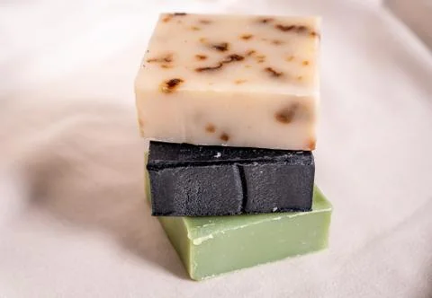 Refreshing handmade soaps made of roses, aloe vera and activated carbon stack Stock Photos