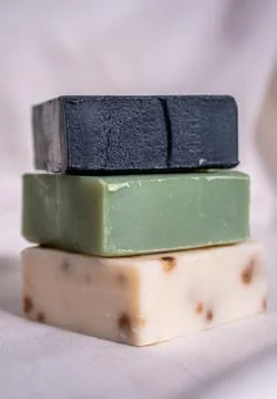 Refreshing handmade soaps made of roses, aloe vera and activated carbon stack Stock Photos
