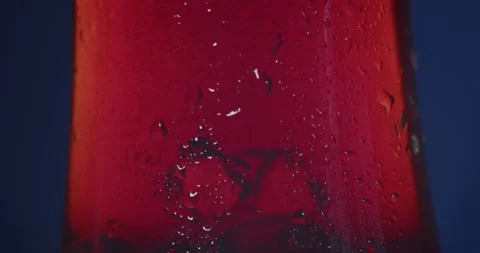 Refreshing Ice Red Alcohol Drink. Glas of colorful refreshing ice cocktail. Coca Stock Footage 246148127