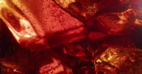 Refreshing Ice Red Alcohol Drink. Glas of colorful refreshing ice cocktail. Stock Footage 246148259
