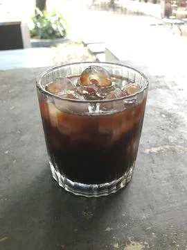 Refreshing Iced Black Coffee in Ribbed Glass Stock Photos
