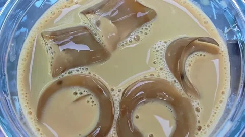 Refreshing iced coffee with ice cubes. Stock Footage 314564308