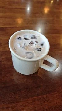 Refreshing Iced Coffee in a Simple White Cup Stock Photos