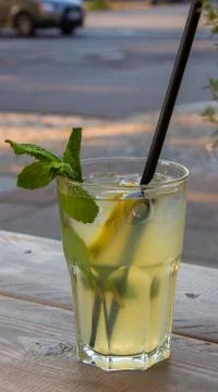 Refreshing iced mint tea with lemon and ice cubes, a drink for hot summer days Stock Photos