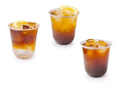 Refreshing iced tea drinks in clear cups with lemon slices Stock Photos