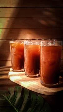 Refreshing Iced Tea Drinks in Tall Glasses on a Wooden Board Stock Photos
