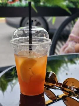 Refreshing iced tea to go, fast-food industry and catering Stock Photos