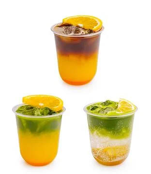 Refreshing layered coffee and matcha drinks with orange slices Stock Photos