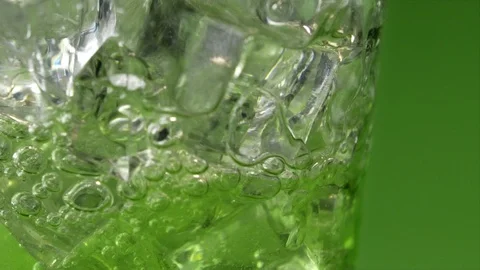 Refreshing Lemon Lime Soda Pour on Green Stock Footage 107992159
