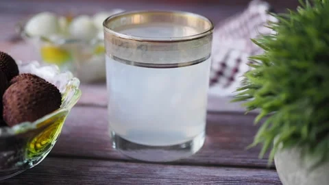 Refreshing lemon water drink placed on a wooden table Stock Footage 337602633