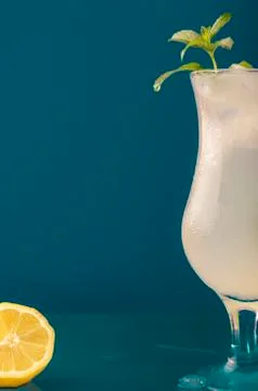 Refreshing lemonade drink against a blue background Stock Photos