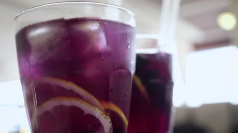 Refreshing lemonade infused with aromatic lavender and anchan tea for an interes 스톡 동영상 239925545