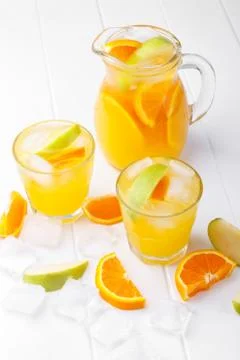 Refreshing lemonade with oranges and apple 스톡 사진