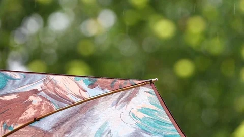 Refreshing light summer rain gently falling on an umbrella. Stock Footage 95551146