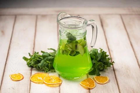 Refreshing lime mint lemonade in glass pitcher Stock Photos