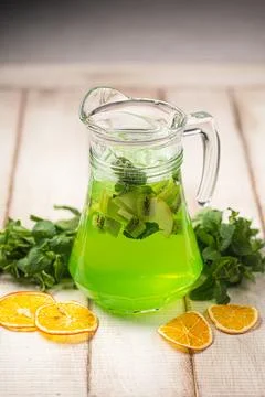 Refreshing lime mint lemonade in glass pitcher Stock Photos
