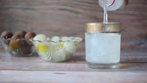 Refreshing lychee drink on a table Stock Footage 338425897