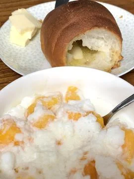 Refreshing mango bingsu with fluffy shaved ice, sweet mango chunks, and cre.. Stock Photos
